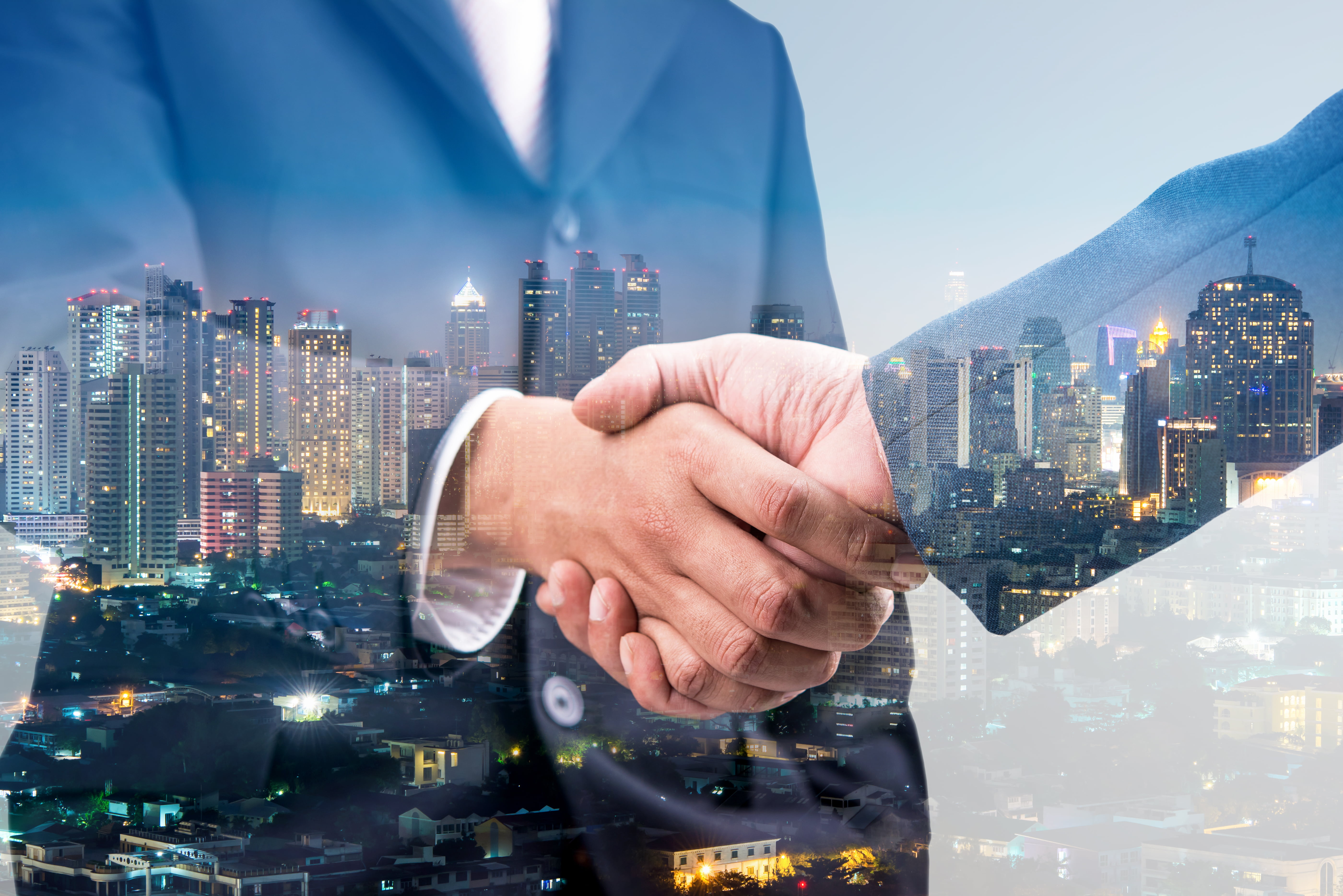 City Background with two businessmen shaking hands | Vital Contingency Planning | vitalcp.com | 800-718-8722